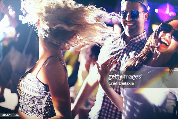 dancing in a nightclub. - headbanging stock pictures, royalty-free photos & images