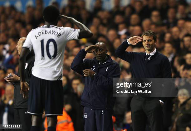 Emmanuel Adebayor of Tottenham Hotspur celebrates scoring his second goal with Tim Sherwood , manager of Tottenham Hotspur and Chris Ramsey during...