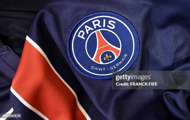 Photo taken on August 6, 2015 in Paris, shows a partial view of the new jersey of the Paris Saint Germain football team. AFP PHOTO / FRANCK FIFE