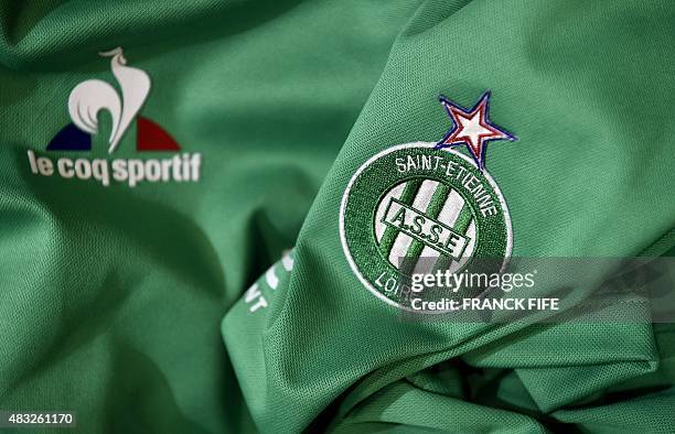 Photo taken on August 6, 2015 in Paris, shows a partial view of the new jersey of the Saint Etienne football team. AFP PHOTO / FRANCK FIFE