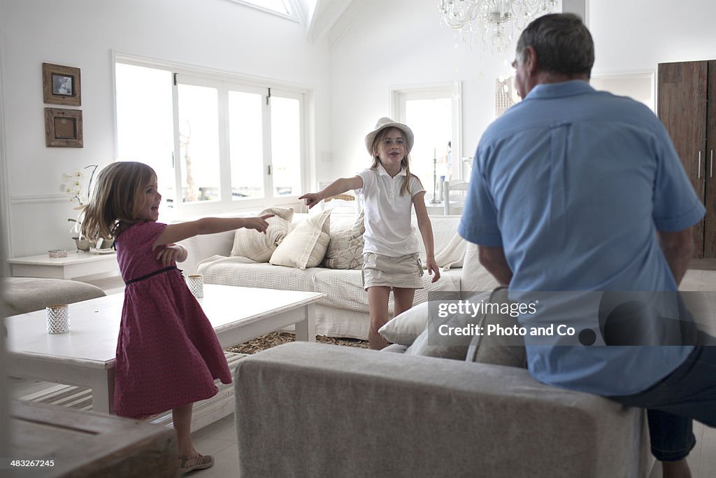 Grandfather playing with his granddaughter