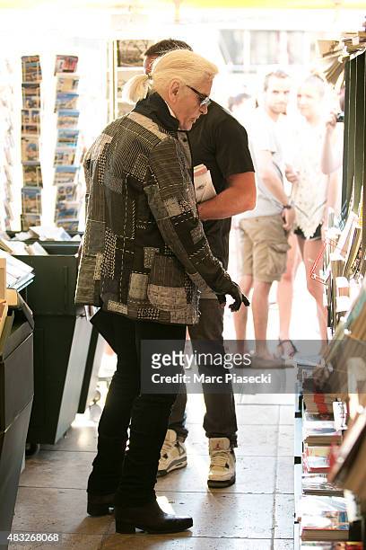 Karl Lagerfeld is seen at the newspaper store on the harbour of Saint tropez on August 6, 2015 in Saint-Tropez, France.