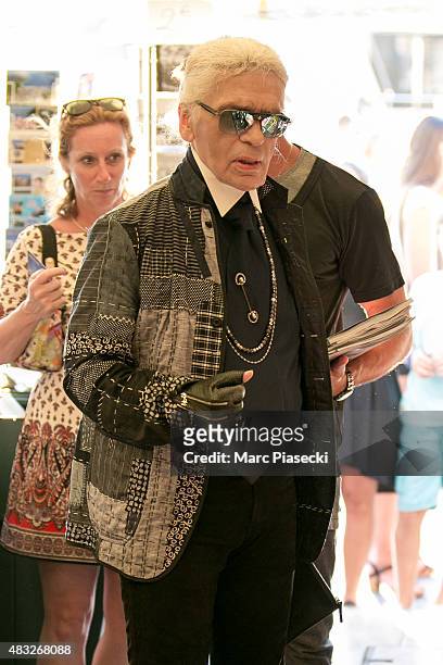 Karl Lagerfeld is seen at the newspaper store on the harbour of Saint tropez on August 6, 2015 in Saint-Tropez, France.
