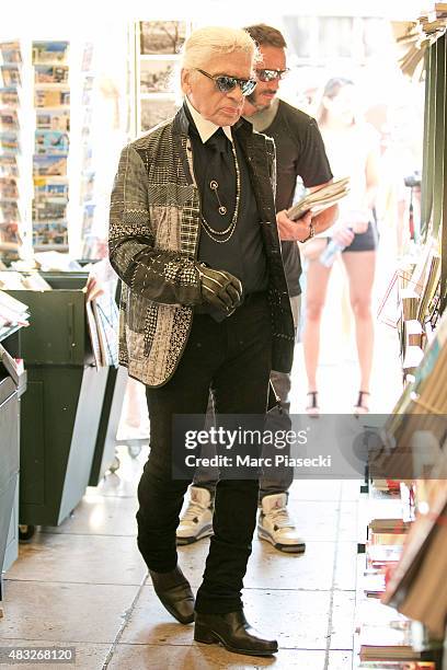 Karl Lagerfeld is seen at the newspaper store on the harbour of Saint tropez on August 6, 2015 in Saint-Tropez, France.