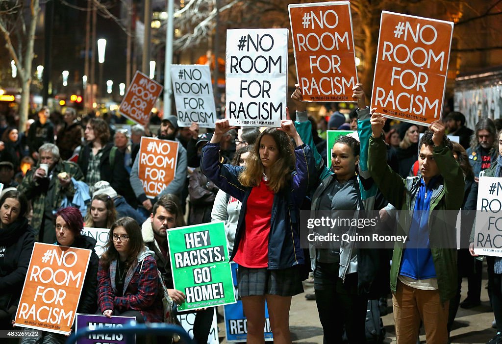 Protesting Against Rasisim Protestors hold up signs at Melbourne City Square on August 7, 2015 ...