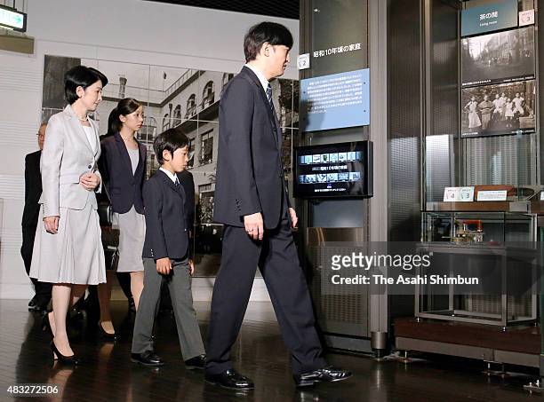 Princess Kiko, Princess Kako, Prince Hisahito and Prince Akishino watch exhibits during their visit to the National Showa Memorial Museum ahead of...