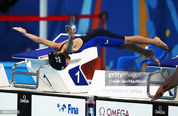 Ten year old Alzain Tareq of Barhain competes in the heats of the Women's 50m Butterfly during day fourteen of The 16th FINA World Swimming...