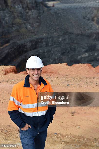 Jacob "Jake" Klein, chairman and co-founder of Evolution Mining Ltd., poses for a photograph in front of the open mine pit at the company's gold...
