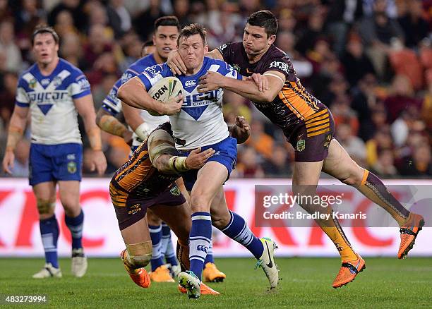 Brett Morris of the Bulldogs attempts to break through the defence during the round 22 NRL match between the Brisbane Broncos and the Canterbury...