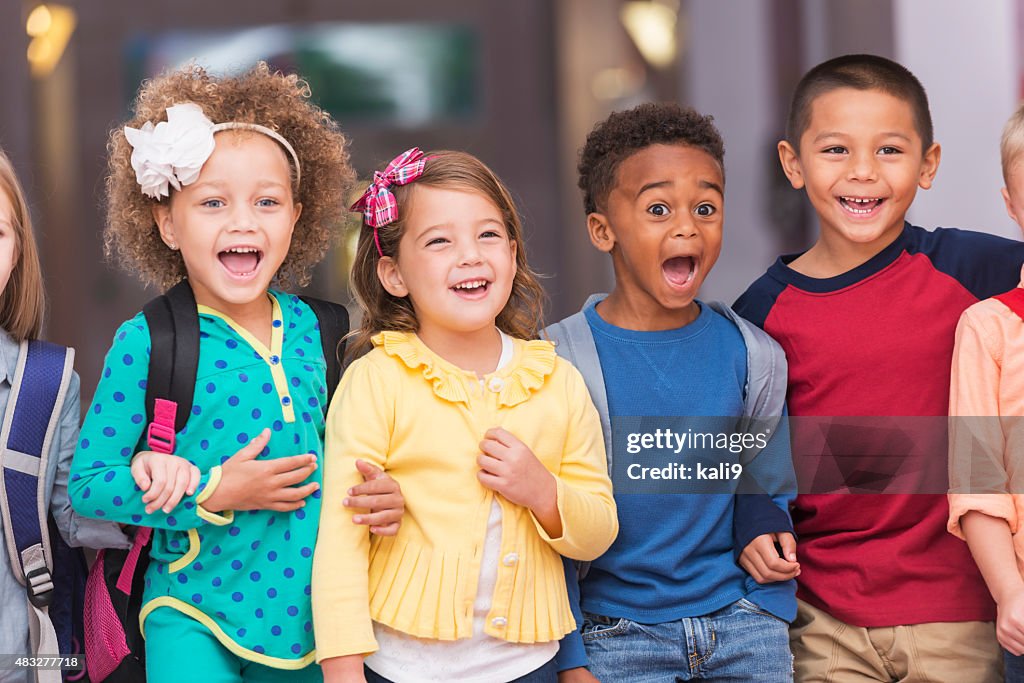 Multiracial group of children in preschool hallway