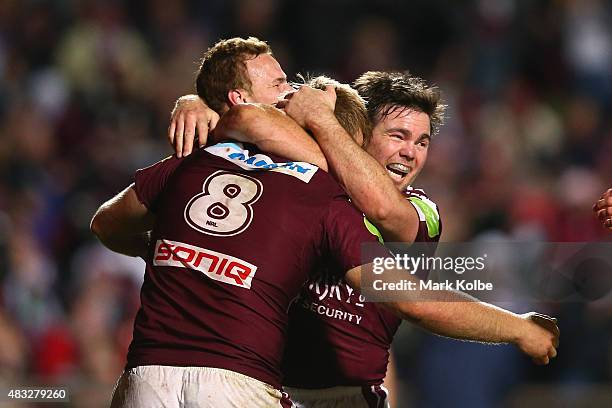 Daly Cherry-Evans, Jake Trbojevic and Jamie Lyon of the Eagles celebrate after Jake Trbojevic scored a try during the round 22 NRL match between the...