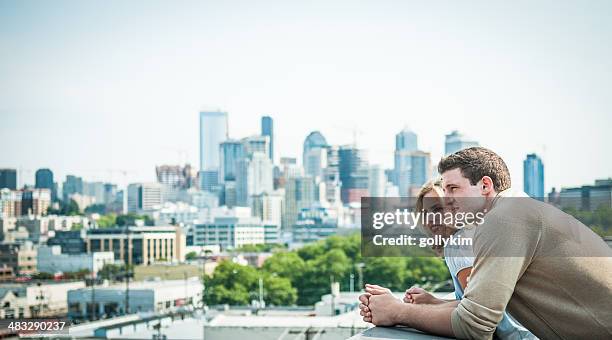 happy  couple at new home - city on the move stock pictures, royalty-free photos & images