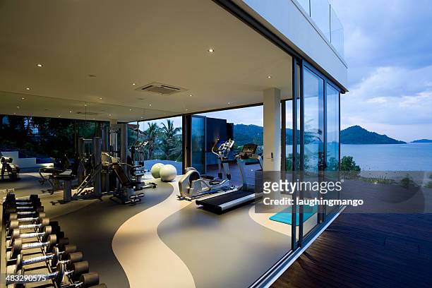 fitness gym health club luxury villa house - luxury mansion interior stock pictures, royalty-free photos & images