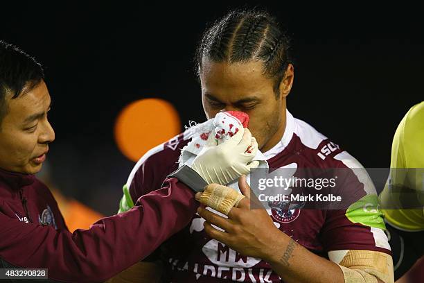 Steve Matai of the Eagles leaves the field with a bleeding nose during the round 22 NRL match between the Manly Sea Eagles and the South Sydney...