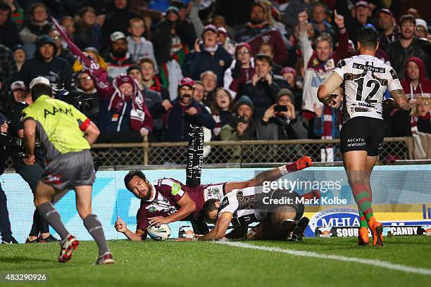 Peter Hiku of the Eagles scores a try during the round 22 NRL match between the Manly Sea Eagles and the South Sydney Rabbitohs at Brookvale Oval on...