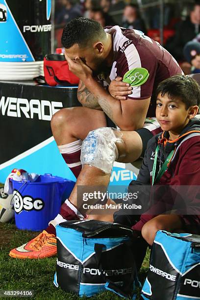 Feleti Mateo of the Eagles sits on the bench with ice on his knee during the round 22 NRL match between the Manly Sea Eagles and the South Sydney...