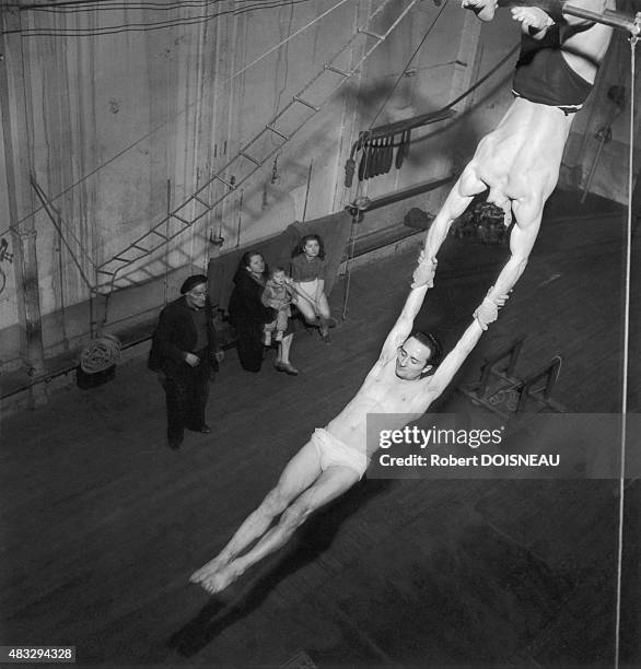 Trapeze artists, 1953 in Paris, France.