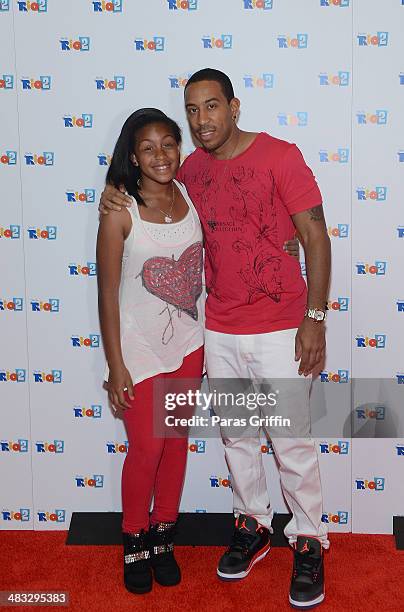 Recording Artist Ludacris and his daughter Karma Bridges attends "Rio 2" screening at Regal Atlantic Station on April 7, 2014 in Atlanta, Georgia.