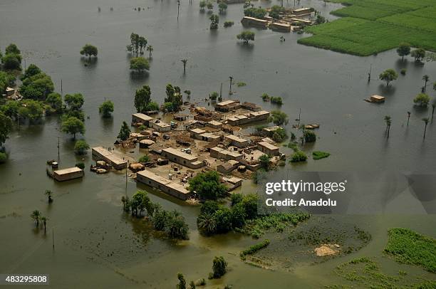 An aerial view of houses inundated with floodwater in Layyah district of Punjab province, Pakistan on August 07, 2015. Torrential rains and flash...