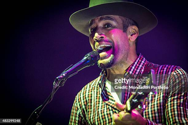 The American singer and musician Ben Harper singing during the concert at Assago Summer Arena and wearing a checked shirt and a Borsalino hat....