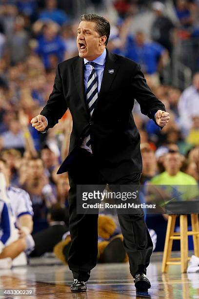 Head coach John Calipari of the Kentucky Wildcats calls to his players during the NCAA Men's Final Four Championship against the Connecticut Huskies...