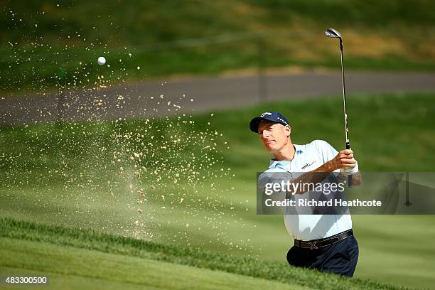 Jim Furyk plays a shot out of a bunker on the 12th hole during the second round of the World Golf Championships - Bridgestone Invitational at...