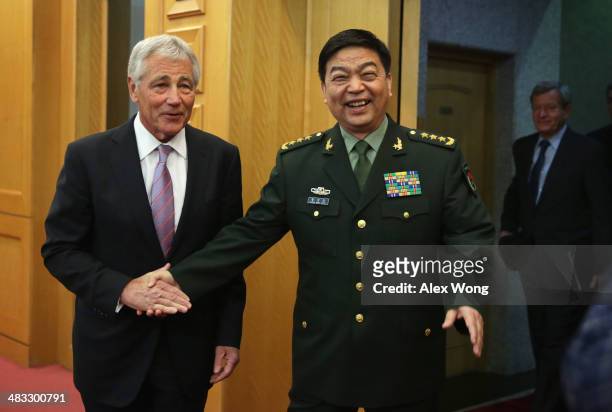 Secretary of Defense Chuck Hagel shakes hands with Chinese Minister of Defense Chang Wanquan prior to their meeting at the Chinese Defense Ministry...
