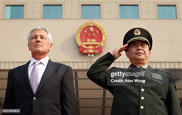 Secretary of Defense Chuck Hagel and Chinese Minister of Defense Chang Wanquan listen to the Chinese national anthem during a welcome ceremony at the...