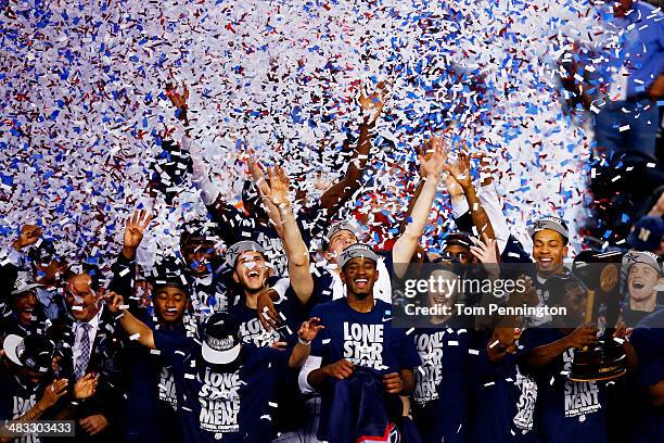 The Connecticut Huskies celebrate after defeating the Kentucky Wildcats 60-54 in the NCAA Men's Final Four Championship at AT&T Stadium on April 7,...