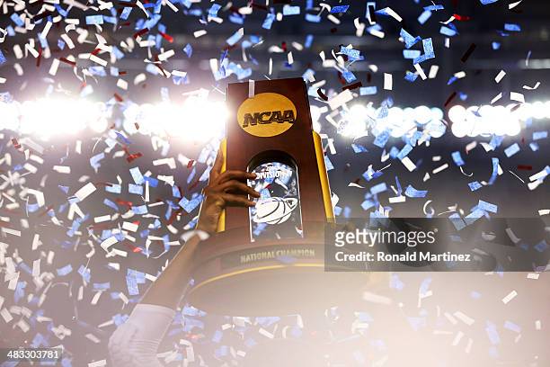 The Connecticut Huskies celebrate with the trophy after defeating the Kentucky Wildcats 60-54 in the NCAA Men's Final Four Championship at AT&T...