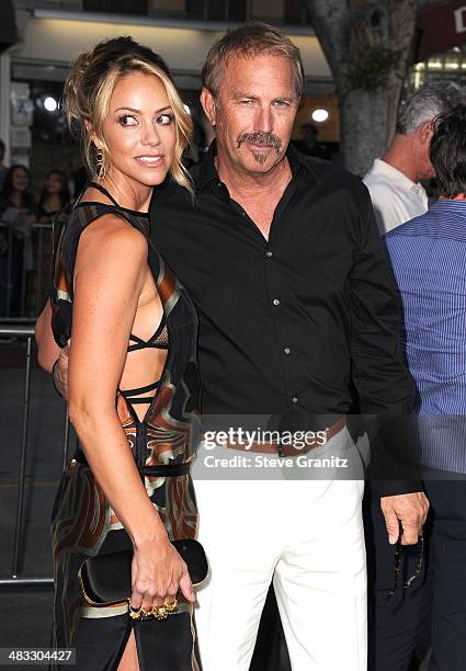 Kevin Costner and Christine Baumgartner arrives at the "Draft Day" - Los Angeles Premiere at Regency Village Theatre on April 7, 2014 in Westwood,...