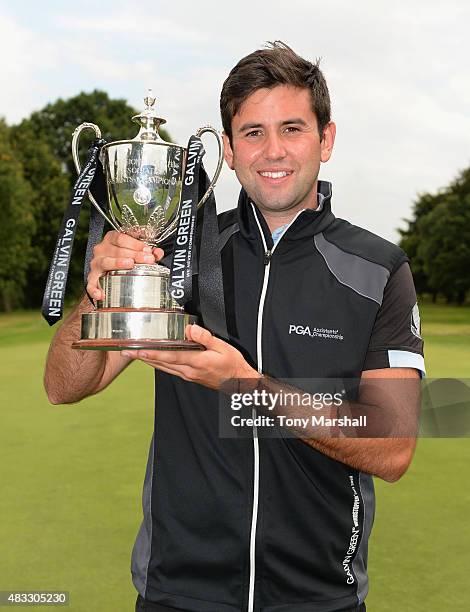 Jack Harrison of Wildwood Golf and Country Club celebrates with the trophy after winning the Galvin Green PGA Assistants' Championship - Day 3 at...