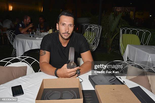 Cedric Gervais poses with new Pryma headset during the Cedric Gervais DJ Set Party at the VIP Room Saint Tropez on August 6, 2015 in Saint-Tropez,...