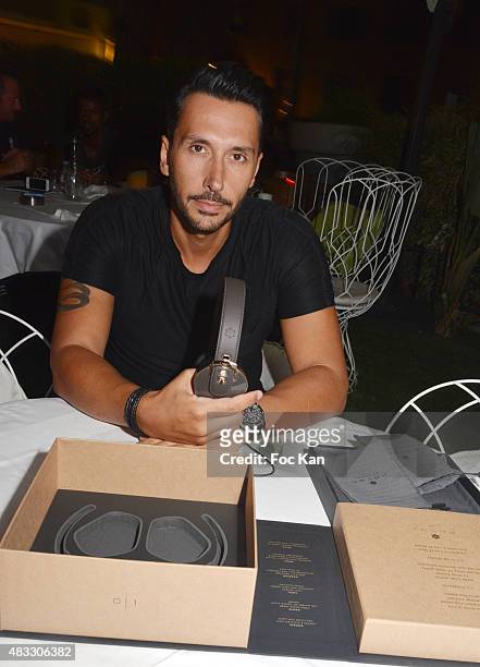 Cedric Gervais poses with new Pryma headset during the Cedric Gervais DJ Set Party at the VIP Room Saint Tropez on August 6, 2015 in Saint-Tropez,...