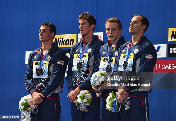 Silver medalists Ryan Lochte, Conor Dwyer, Reed Malone and Michael Weiss of the United States pose during the medal ceremony for the Men's 4x200m...