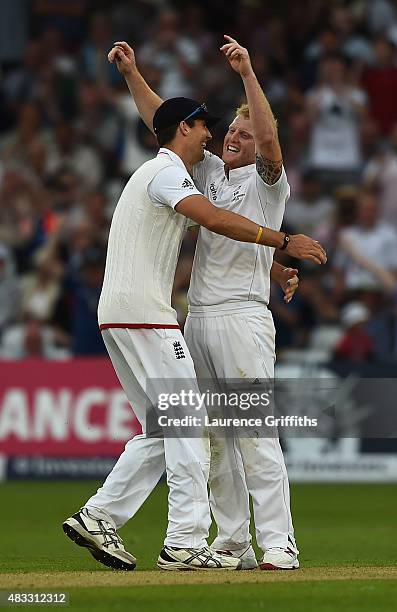 Ben Stokes of England is congratulated by Steven Finn on taking the wicket of Mitchell Johnson of Australia during day two of the 4th Investec Ashes...