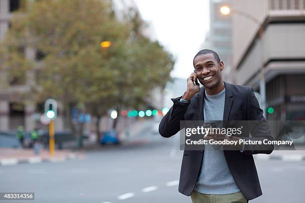 i'll keep you posted - african people street stock pictures, royalty-free photos & images