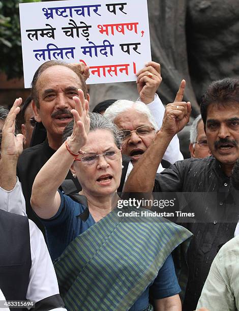 Congress President Sonia Gandhi shouts slogans against thr Modi Government during a protest with leaders of Congress, RJD and SP during the Monsoon...