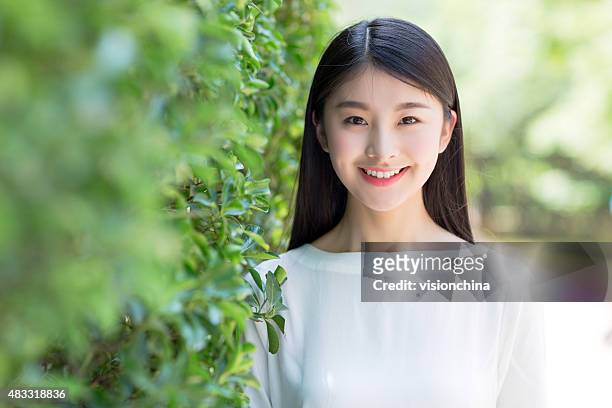 outdoors portrait of beautiful young brunette girl. - beautiful asian girls stock pictures, royalty-free photos & images