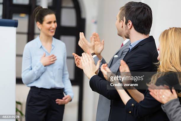 applauding fsuccessful presentationor - adulation stock pictures, royalty-free photos & images