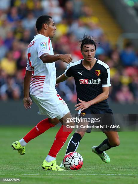 Steven Berghuis of Watford and Timothee Kolodziejczak of Sevilla during the pre-season friendly between Watford and Seville at Vicarage Road on July...