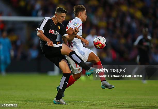 Craig Cathcart of Watford and Denis Suarez of Sevilla during the pre-season friendly between Watford and Seville at Vicarage Road on July 31, 2015 in...