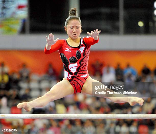 Koko Tsurumi of Japan competes in the Uneven Bars apparatus final during day four of the Guangzhou Asian Games at Guangzhou Gymnasium on November 16,...