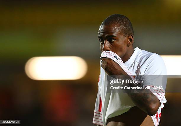 Gael Kakuta wipes his mouth of Sevilla during the pre-season friendly between Watford and Seville at Vicarage Road on July 31, 2015 in Watford,...