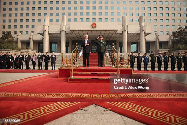 Secretary of Defense Chuck Hagel and Chinese Minister of Defense Chang Wanquan listen to the U.S. National anthem during a welcome ceremony at the...