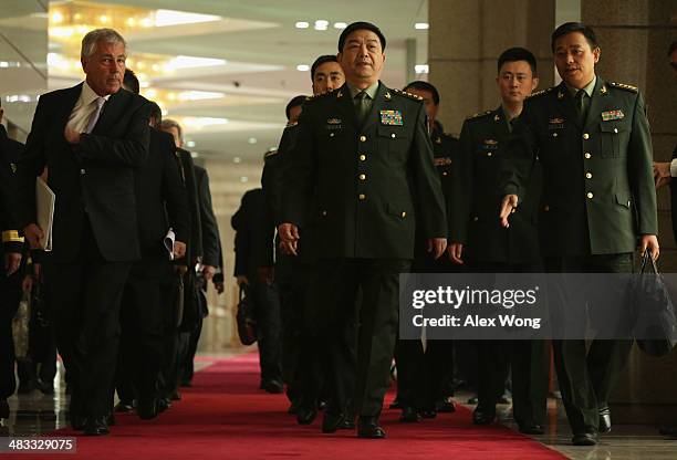 Secretary of Defense Chuck Hagel and Chinese Minister of Defense Chang Wanquan arrive at a joint news conference at the Chinese Defense Ministry...