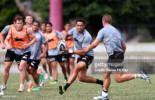 John Sutton looks to pass during a South Sydney Rabbitohs NRL training session at Redfern Oval on April 8, 2014 in Sydney, Australia.
