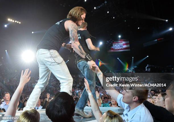 Singers Tyler Hubbard and Brian Kelley of Florida Georgia Line perform onstage during ACM Presents: An All-Star Salute To The Troops at the MGM Grand...