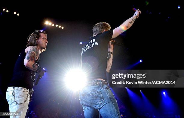 Singers Tyler Hubbard and Brian Kelley of Florida Georgia Line perform onstage during ACM Presents: An All-Star Salute To The Troops at the MGM Grand...