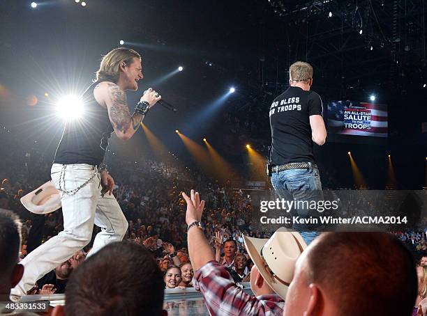 Singers Tyler Hubbard and Brian Kelley of Florida Georgia Line perform onstage during ACM Presents: An All-Star Salute To The Troops at the MGM Grand...